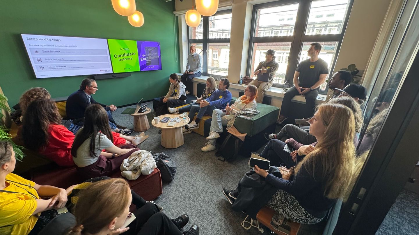 Enterprise UX session discussion in a cozy lounge corner